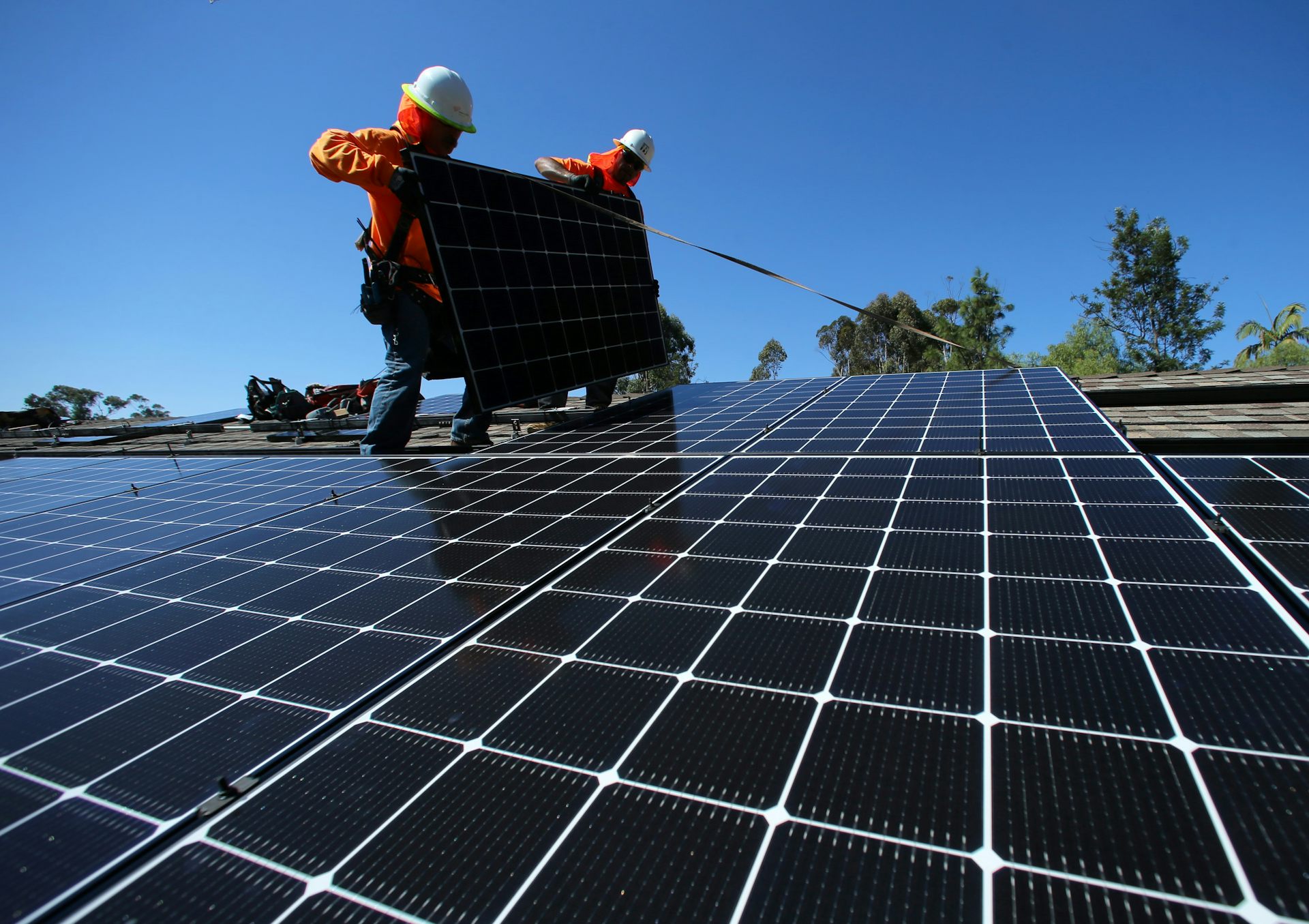 solar panel installation on their roof, checking efficiency